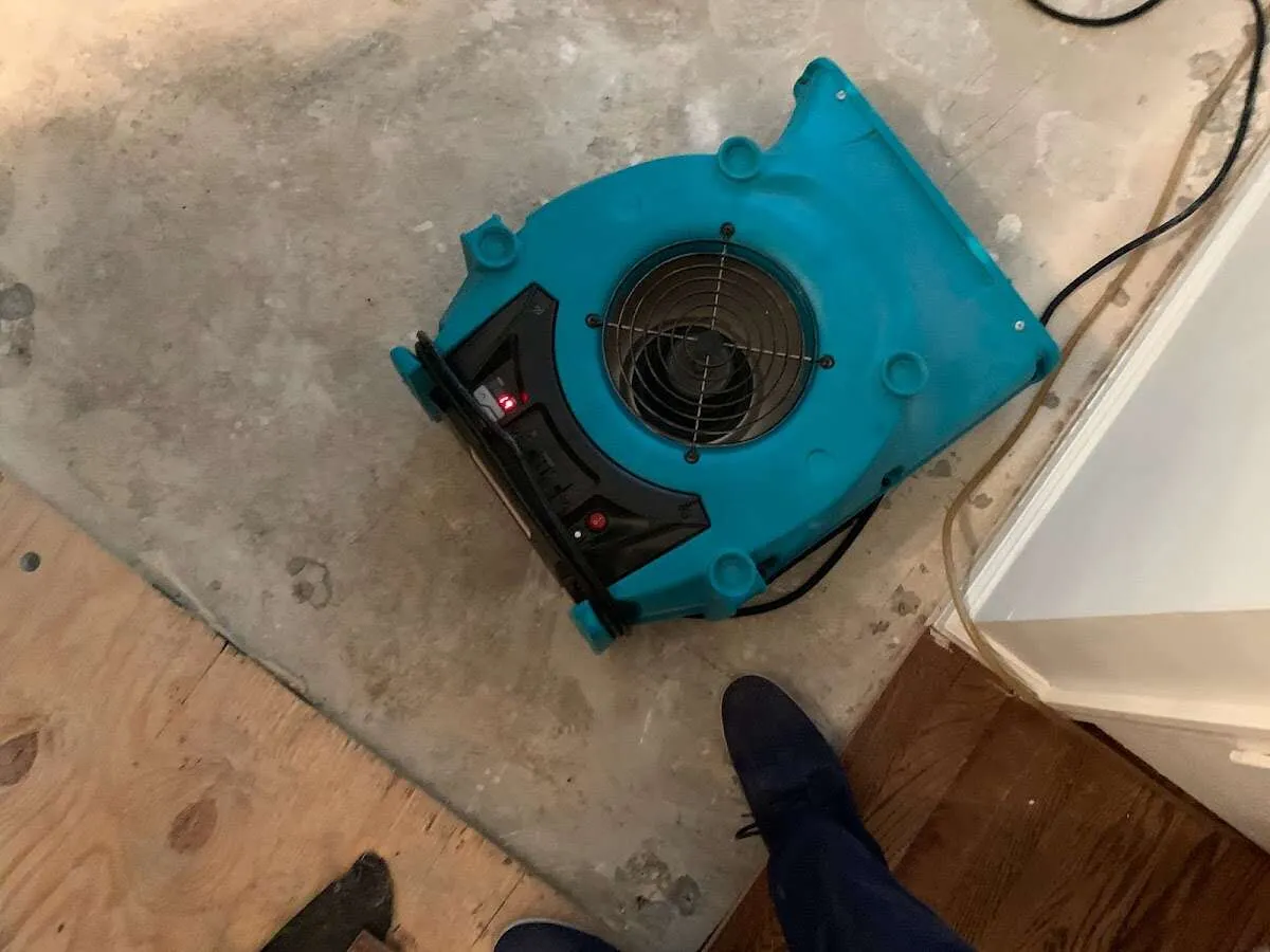 Air mover drying subfloor during Leak Detection & Repair in Sanford